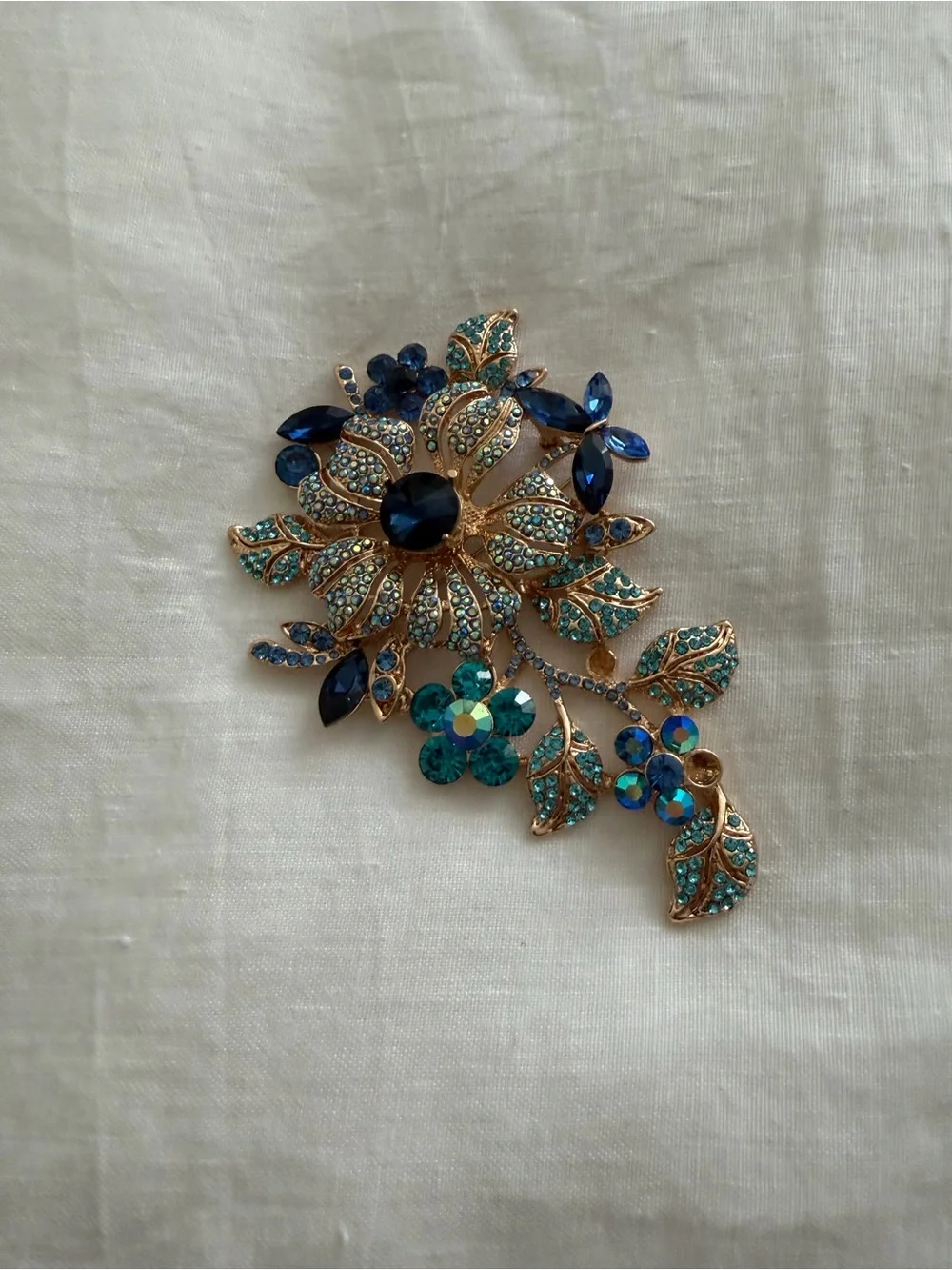 Gold-Tone Floral Crystal Brooch in Blue and Teal